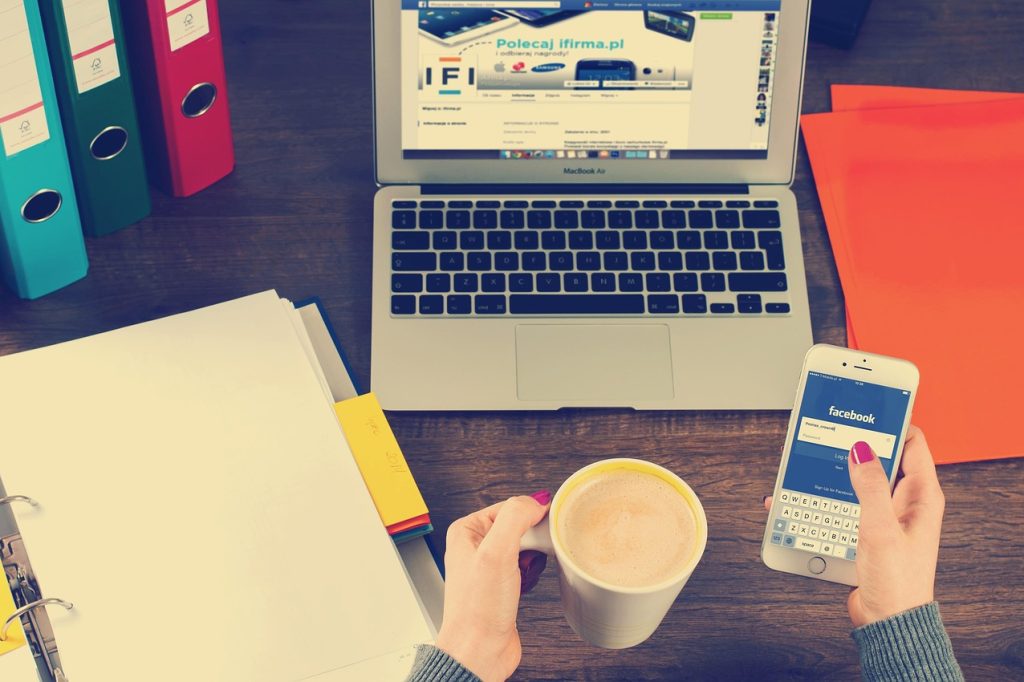 Laptop, iphone, workspace — Achieve a Clean Online Presence with Effective Mugshot Removal Solutions