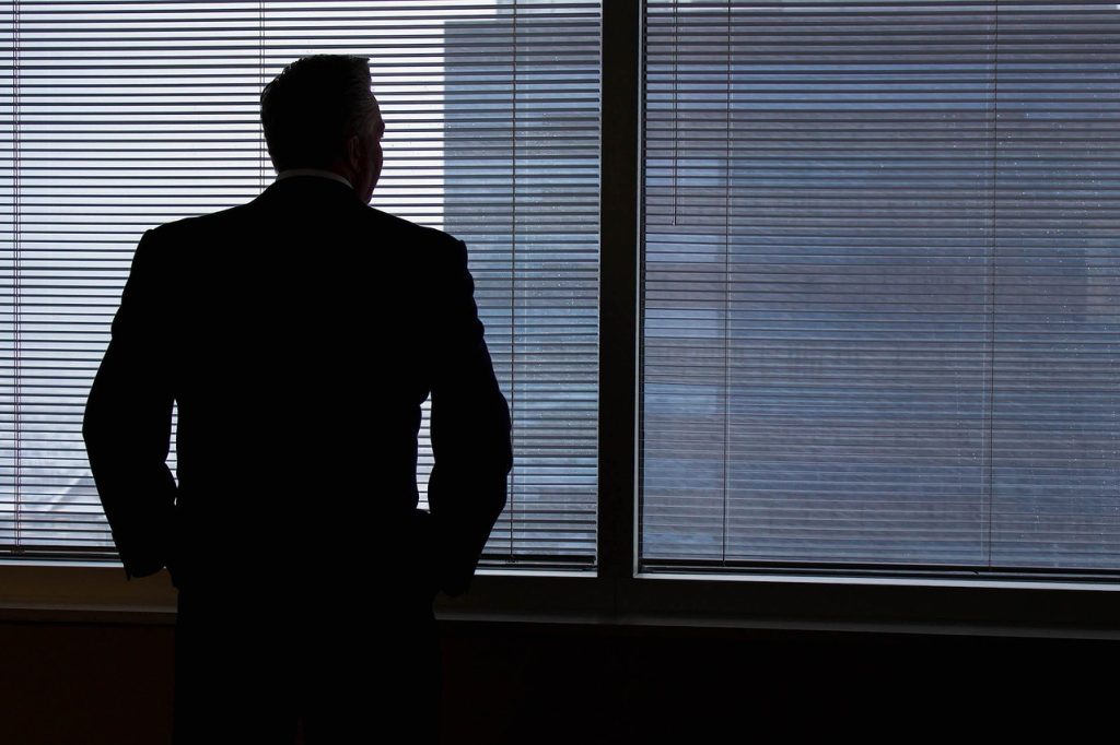 Businessman, silhouette, windows — Fast ways to get breast implants Miami